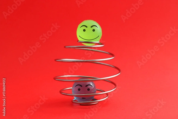 Obraz Happy sphere breaks free from spiral while another remains trapped