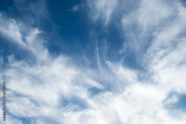 Obraz white clouds in a soft blue sky