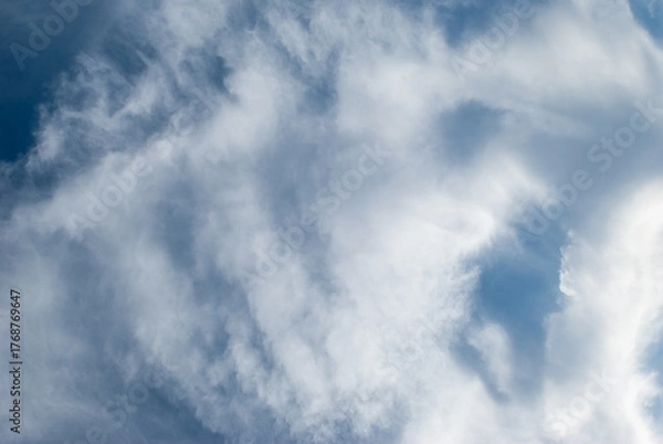 Obraz white clouds in a soft blue sky