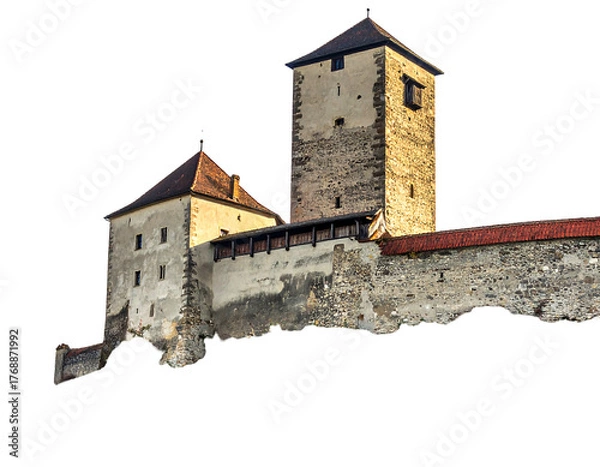Fototapeta A medieval castle with a tall stone tower and fortified walls, bathed in golden light