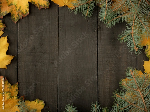 Obraz Gold yellow fall maple leaves and evergreen pine spruce branch needles greenery on black Halloween rustic wood plank table. Autumn seasonal overhead flatlay
