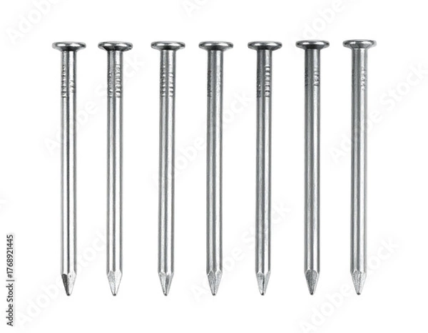 Fototapeta Eight shiny silver nails stand vertically in a neat row against a dark background, showing sharp points