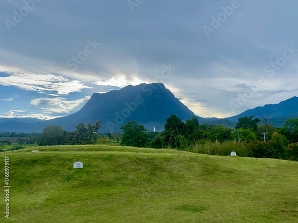 Fototapeta Green yard with mountain chiang dao located in Chiang mai northern part of Thailand