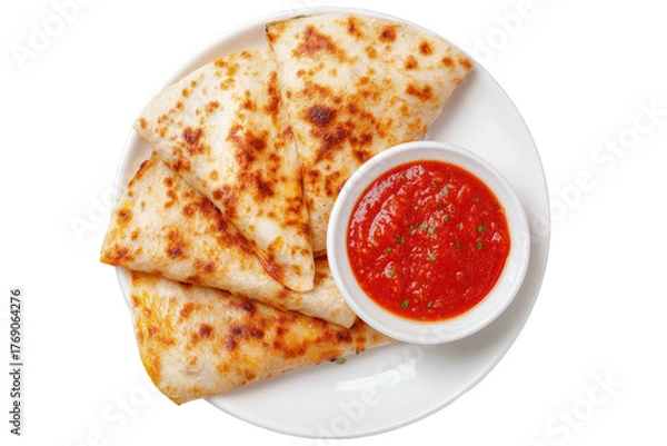 Fototapeta Quesadilla slices with a tomato sauce on a white plate
