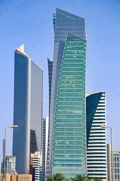 Fototapeta Modern Glass Skyscrapers Against Clear Blue Sky – Contemporary Urban Architecture Of Kuwait City