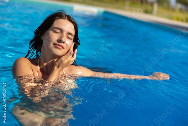 Fototapeta Relaxing in the Pool A Serenity Found in the Tranquil Waters of Leisure and Joy