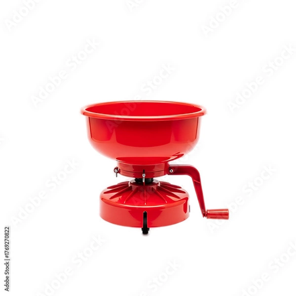 Fototapeta A vibrant red kitchen gadget with a bowl-like top, hand crank, and sturdy base isolated against black