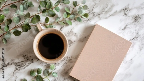 Fototapeta Top view of coffee cup, notebook and eucalyptus branch on marble table