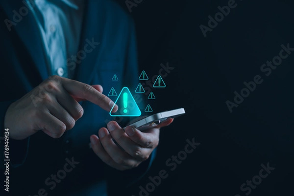 Fototapeta Businessman using computer with system warning alerts, Concept of cyber threat, phishing, scam messages, suspicious calls, and online security risks on communication.