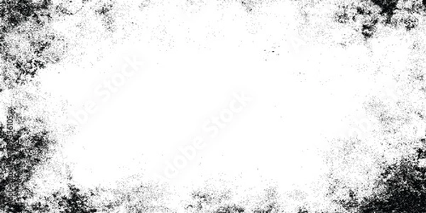 Fototapeta Grunge speckled border frame with black ink splatter on white background, distressed texture with copy space for design.