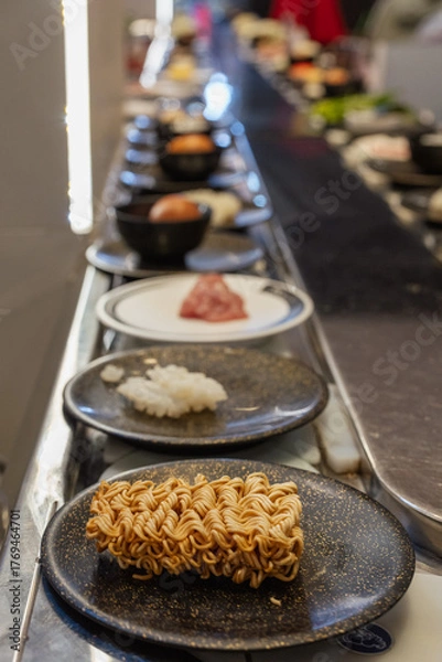 Obraz Instant Ramen Noodles on Plate at Shabu-Shabu Conveyor Belt Restaurant