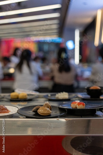 Fototapeta Stuffed Fish Balls with Crab Roe on Plate at Shabu-Shabu Conveyor Belt Restaurant