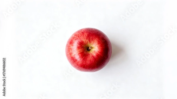 Fototapeta Overhead View of a Perfectly Ripe Red Apple on White Background