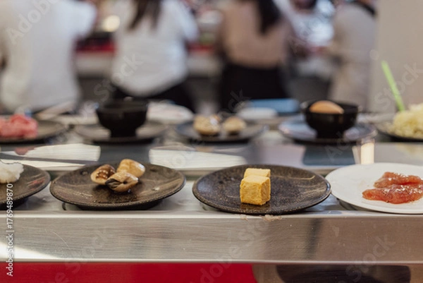 Fototapeta Tofu Cubes on Plate at Shabu-Shabu Conveyor Belt Restaurant