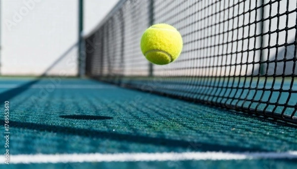 Obraz Tennis ball bouncing over court net
