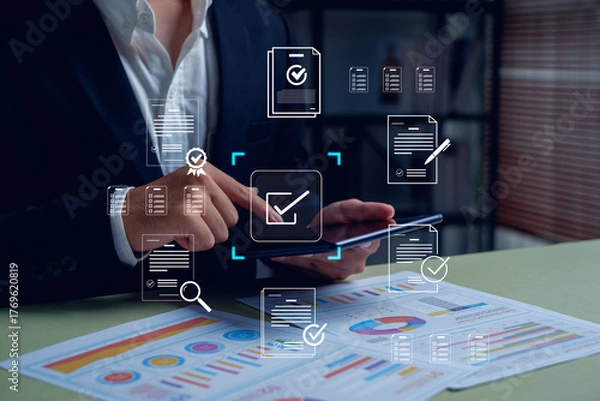 Fototapeta business professional using a tablet for digital document approval and data analysis. Concept of paperless workflow, e-signature, compliance management, and online business automation.