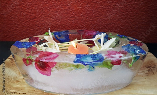 Fototapeta Eco-friendly Ice krathong for Loy Krathong festival in Thailand, a zero-waste alternative to traditional one, made by freezing water with natural elements inside