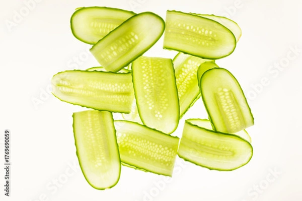 Fototapeta Beautiful fresh transparent cucumber slices on white background