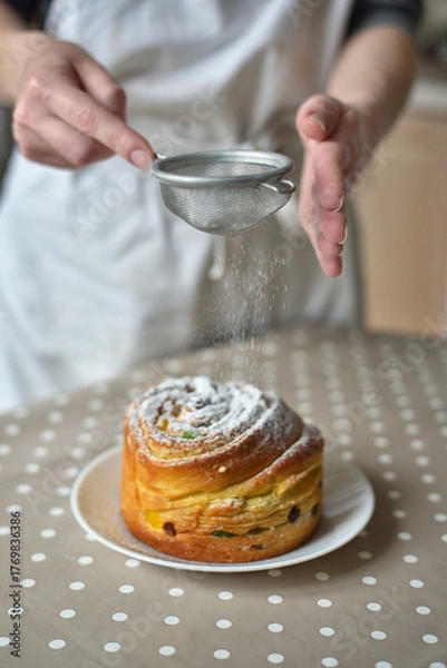 Obraz Hand Dusting Easter Cakes with Powder