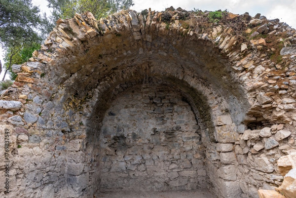Fototapeta Kaunos (Carian: Kbid Lycian: Xbide Ancient Greek: Καῦνος; Latin: Caunus) ancient city was a city of ancient Caria and in Anatolia, a few kilometres west of the modern town of Dalyan. Amphitheatre area