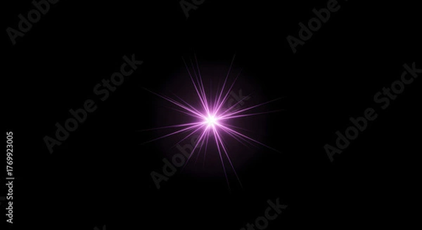 Fototapeta Vibrant purple starburst light effect shining brightly in the dark.