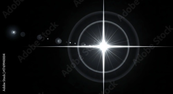 Fototapeta Bright starburst lens flare effect with concentric rings on a dark background