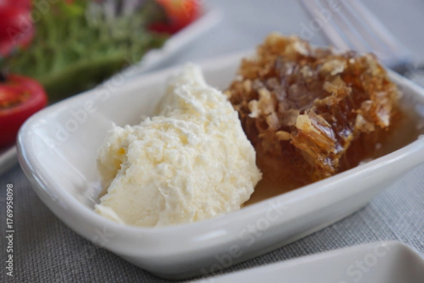 Fototapeta Delicious dessert with creamy ice cream and honeycomb treat
