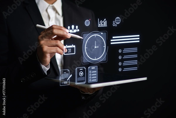 Fototapeta Businessman using digital tablet with virtual task icons for time management, project planning, productivity, team collaboration data analysis in modern workplace or remote work setting.