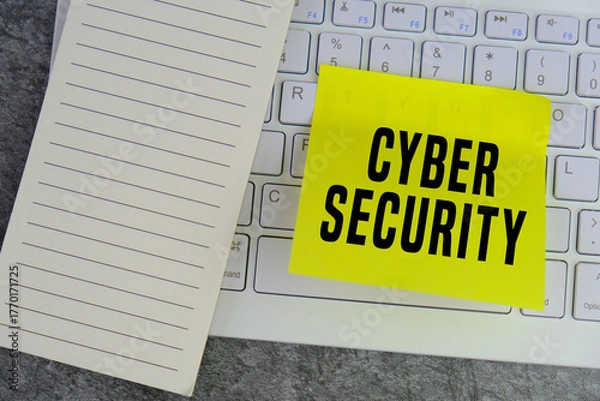 Fototapeta Cyber security concept. Computer keyboard and yello memo