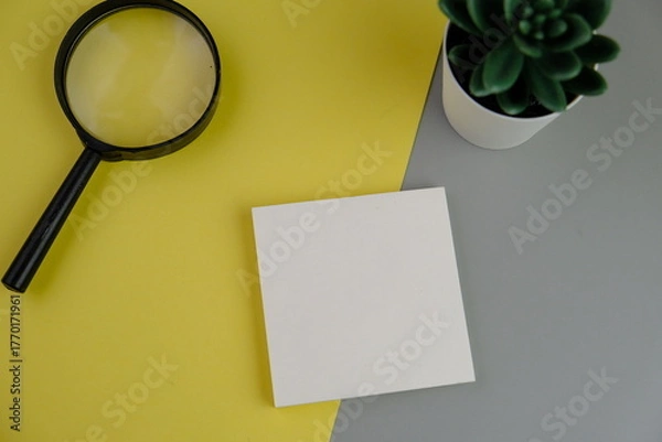 Fototapeta blank paper next to school tools with no word as a template for text space concept. business and education concept