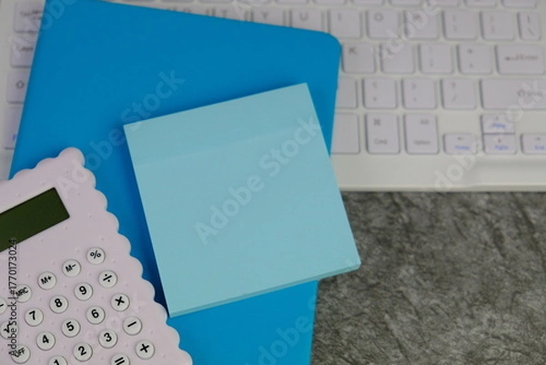 Fototapeta blank paper next to school tools with no word as a template for text space concept. business and education concept