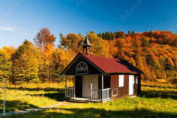 Obraz Wooden church in autumn forest, Zagorze Slaskie, Lower Silesia, Poland. 