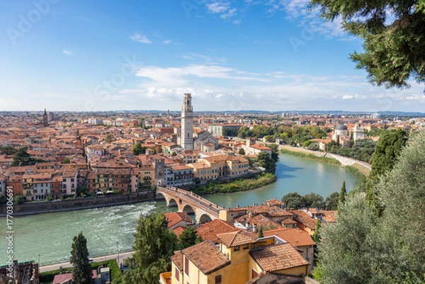Obraz Aerial panorama of Verona, Italy, featuring the Duomo di Verona and the ancient Ponte Pietra bridge crossing the Adige River, surrounded by red-tiled roofs and the historic heart of the Veneto region