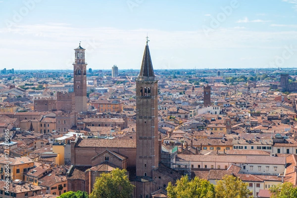 Fototapeta Aerial panoramic view of Torre dei Lamberti in Piazza delle Erbe, Verona, Italy - an iconic medieval bell tower, surrounded by red-tiled roofs and the historic heart of the Veneto region