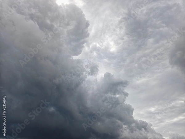 Fototapeta Dramatic close-up of heavy, dark gray cumulonimbus and stratocumulus clouds in sky