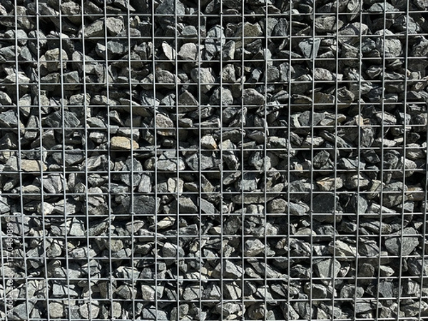 Fototapeta Gabion, texture, background. Gabion net frequent part (design). New technologies in the manufacture of retaining walls and fences. Landscaping. Fencing decorative elements