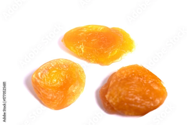 Fototapeta Dried apricot fruits isolated over white background