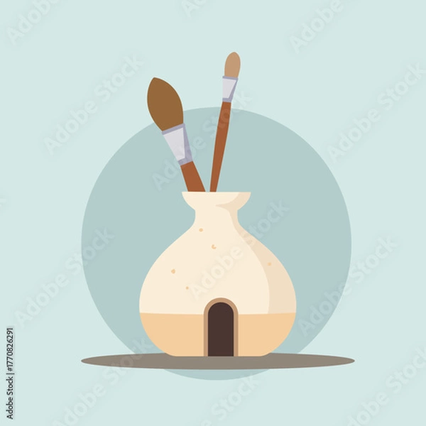 Fototapeta Art supplies in a ceramic holder with paintbrushes on countertop  