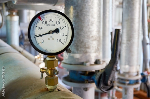 Obraz Manometer on the hot water pipeline in the boiler room.