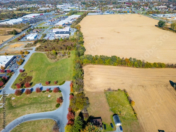 Fototapeta Aerial drone view of landscapes during the fall. Farm fields. 
