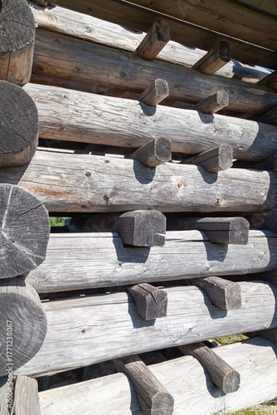 Fototapeta Corner of Wooden Log Cabin with Notched Joint, Close-Up
