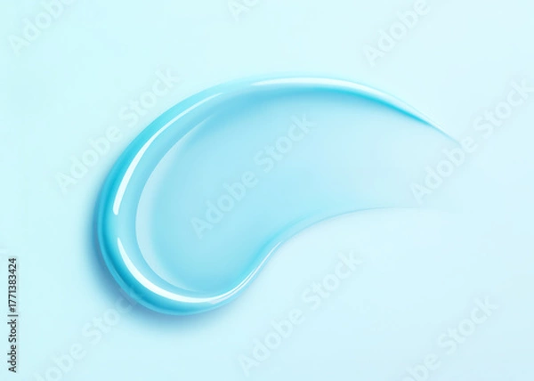 Fototapeta Soft blue lip gloss swatch on pastel background. Close-up of liquid lipstick, glossy texture, horizontal flatlay. Professional studio light