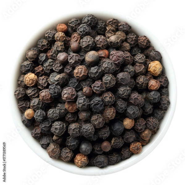 Obraz A bowl contains assorted black peppercorns, showcasing their unique shapes and colors, perfect for culinary use