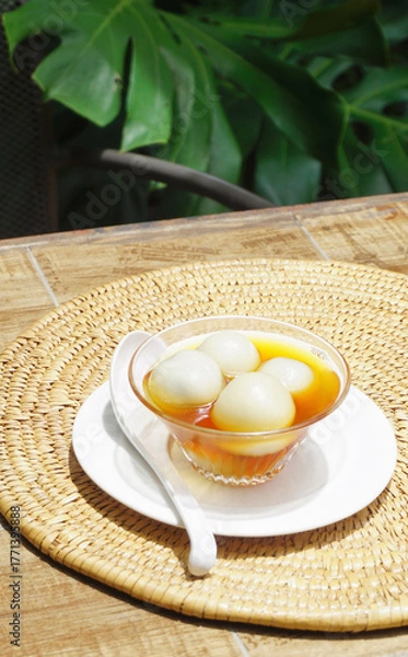 Obraz Black sesame dumplings in ginger syrup, Chinese sweet dessert