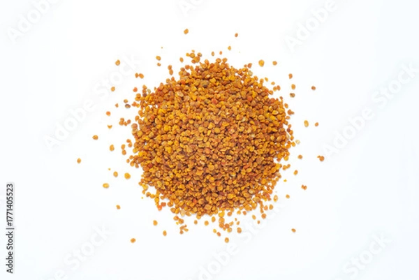 Fototapeta Pile of bee pollen grains isolated on white background. Top view