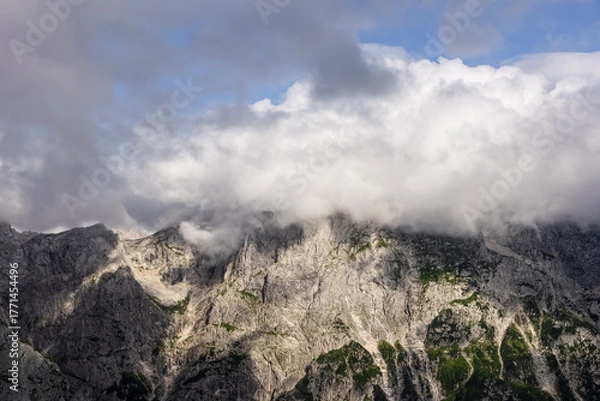 Fototapeta beautiful panoramic view of mountain peak covered by clouds. minimalist mountain landscape wallpaper. mountain background 