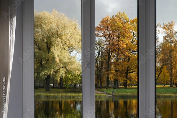 Fototapeta Window frame, view from the window  on yellow trees, landscape with autumn forest.