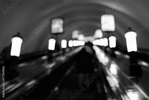 Fototapeta Blurred Underground Escalator with Lights and Motion in Subway Tunnel