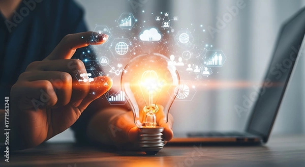 Fototapeta Man holding light bulb with business icons, concept of idea and innovation