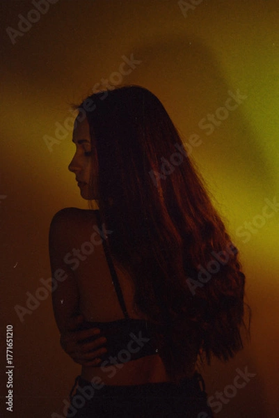 Obraz Moody Neon Portrait of Woman with Creative Lighting and Motion Blur